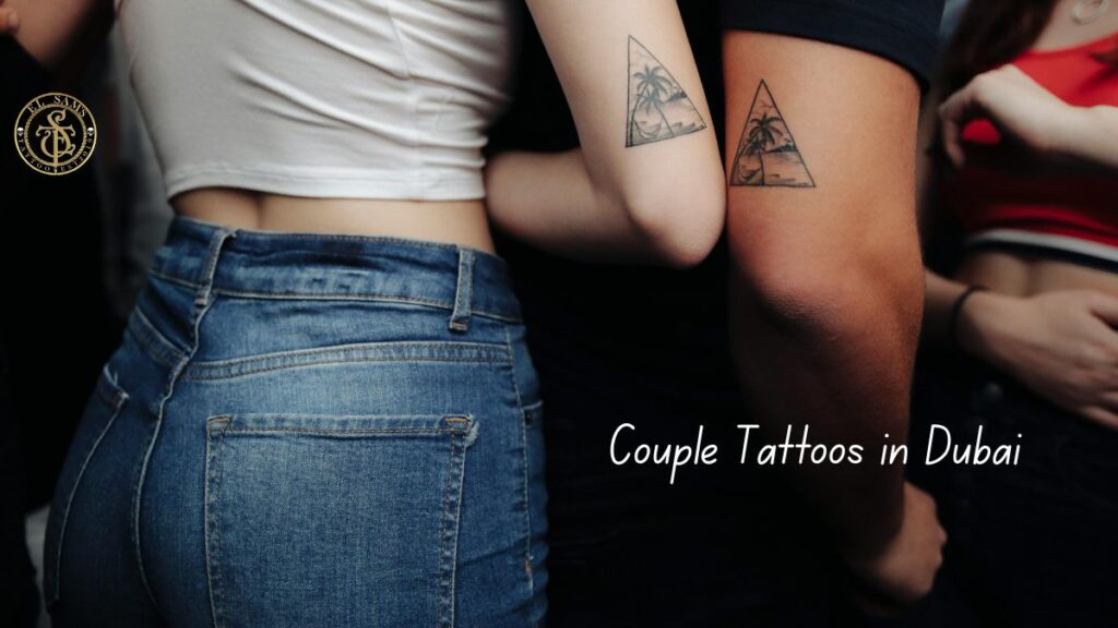 Couple showing matching tattoos from EL Sam tattoo artist in Dubai