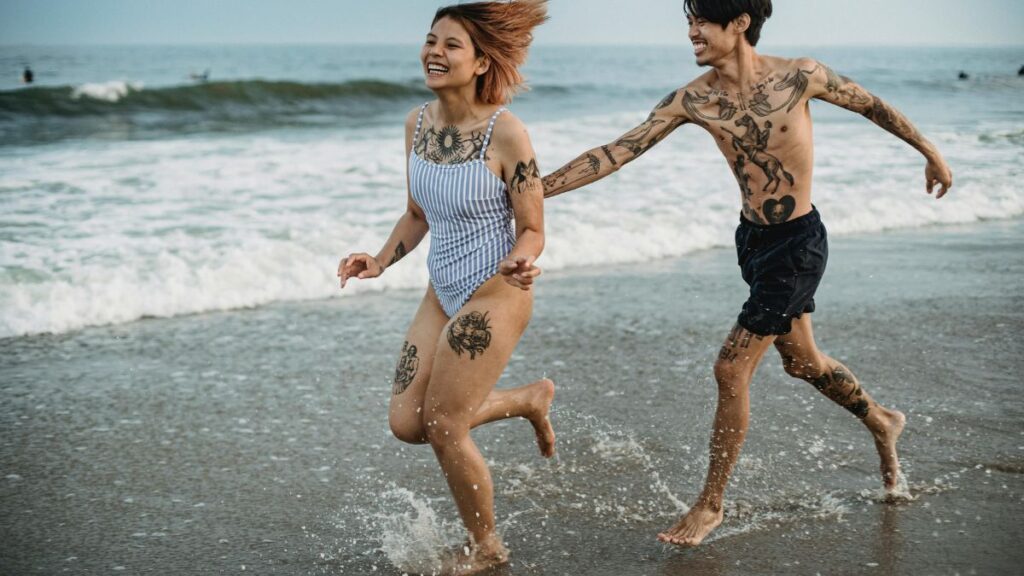 Custom couple tattoo design by a skilled tattoo artist in Dubai El Sam tattoo studio